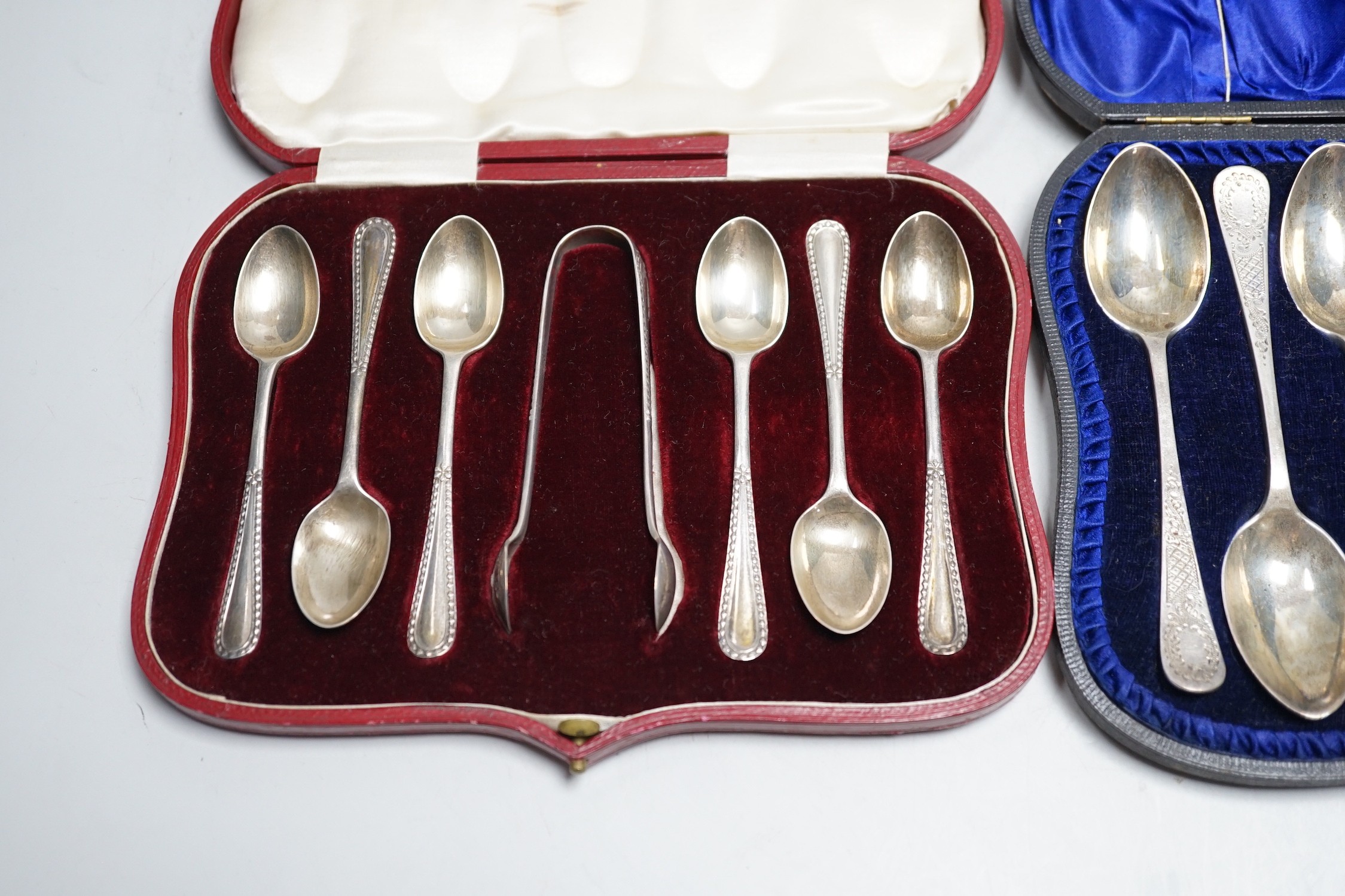 Two cased sets of six silver teaspoons and sugar tongs, including Sheffield, 1908.